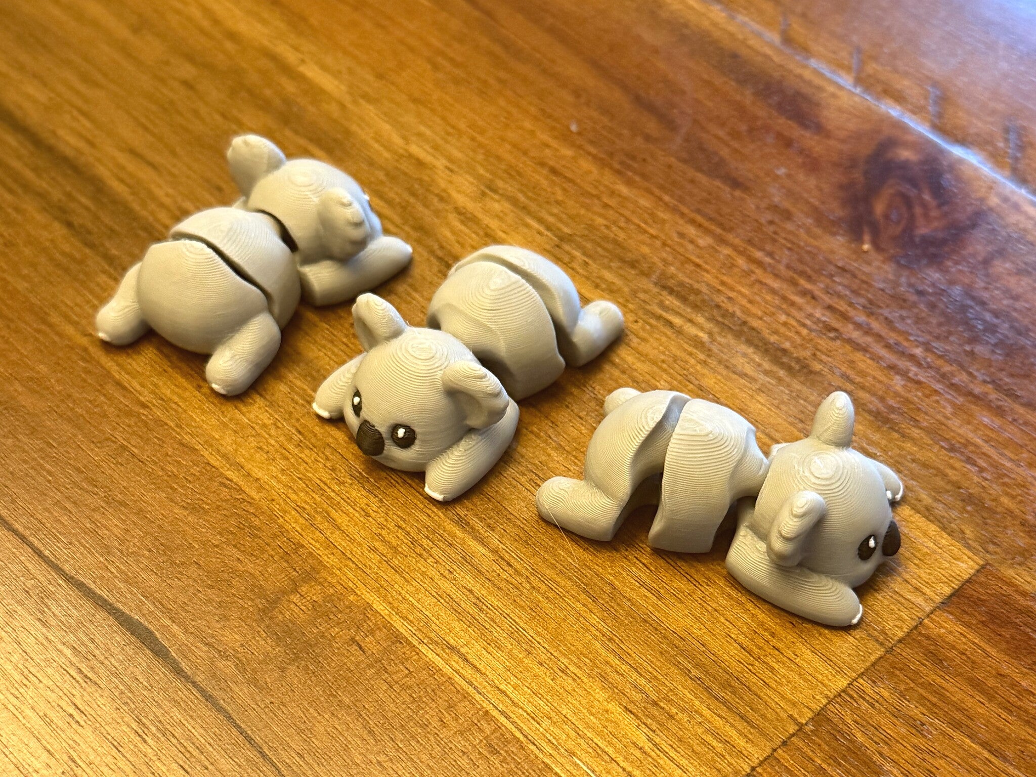 Four flexi koalas from another angle showing the bending waist joint